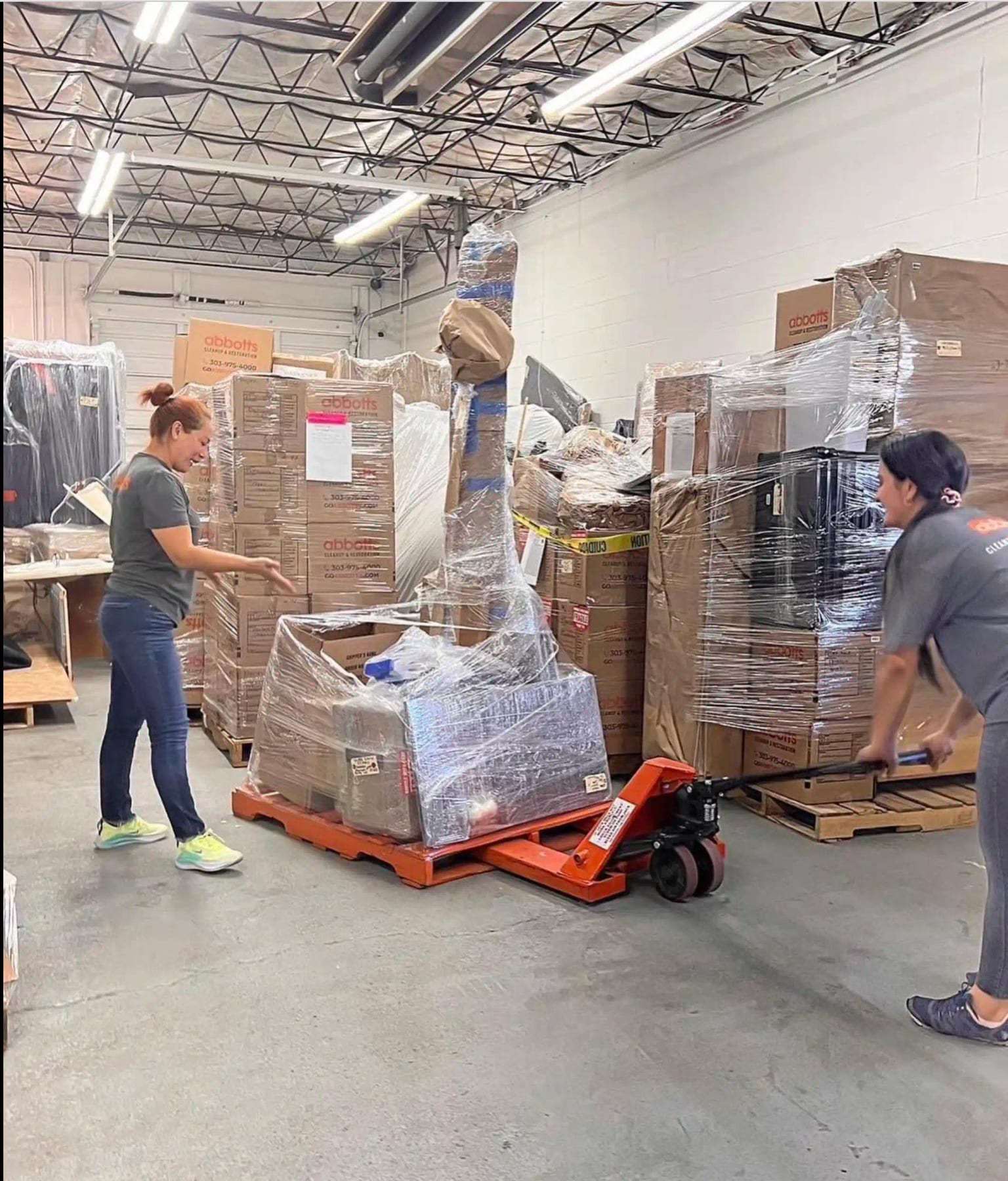 Warehouse contents wrapped on pallets during a pack-out