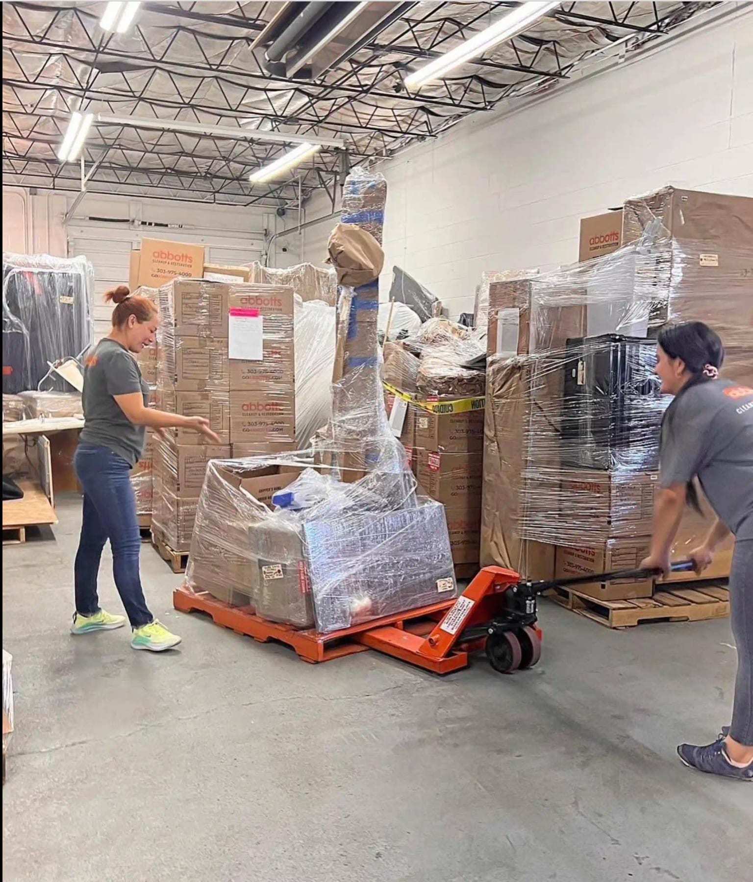 Warehouse contents wrapped on pallets during a pack-out