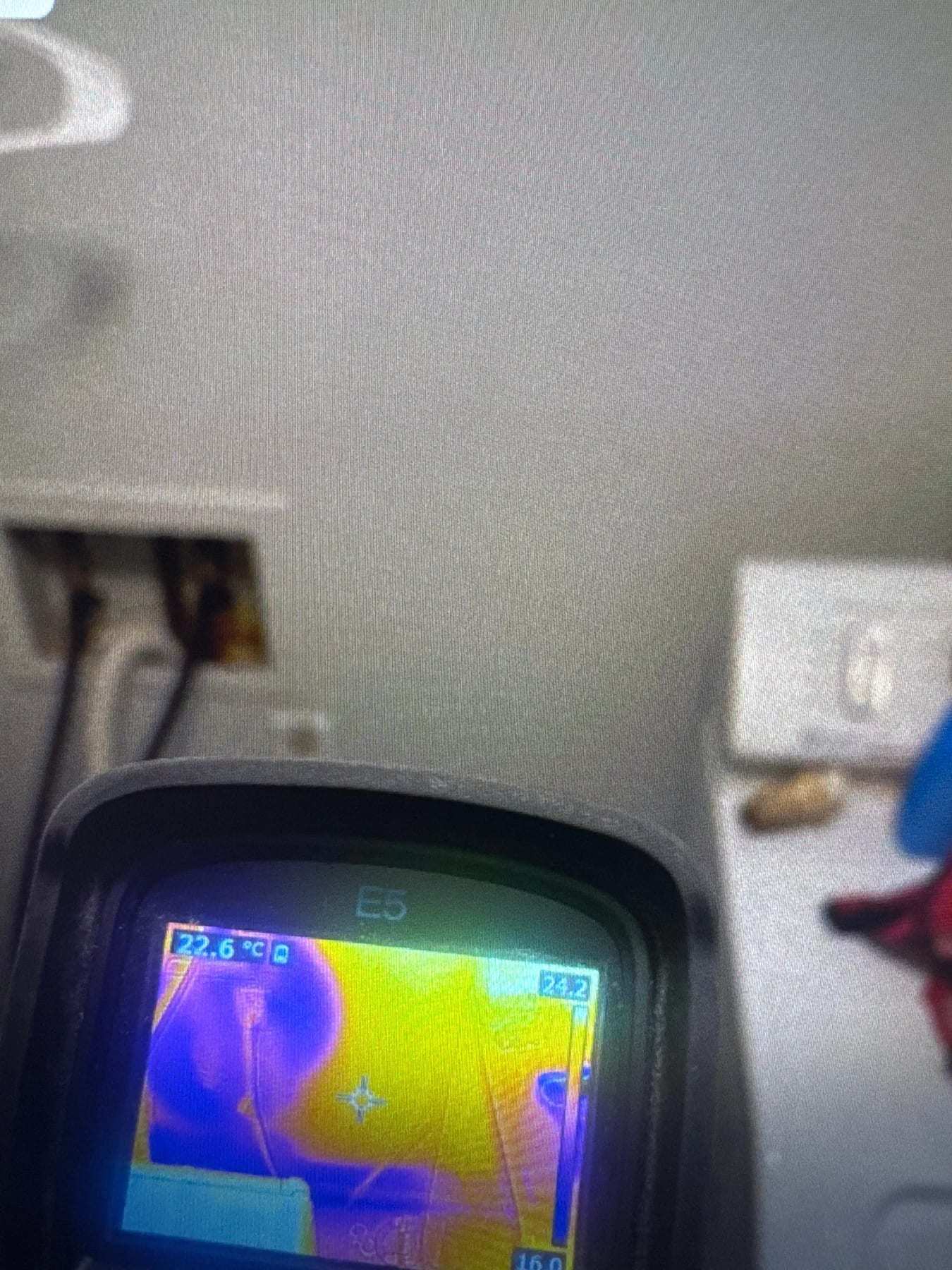 Thermal camera showing a cool patch on a textured wall
