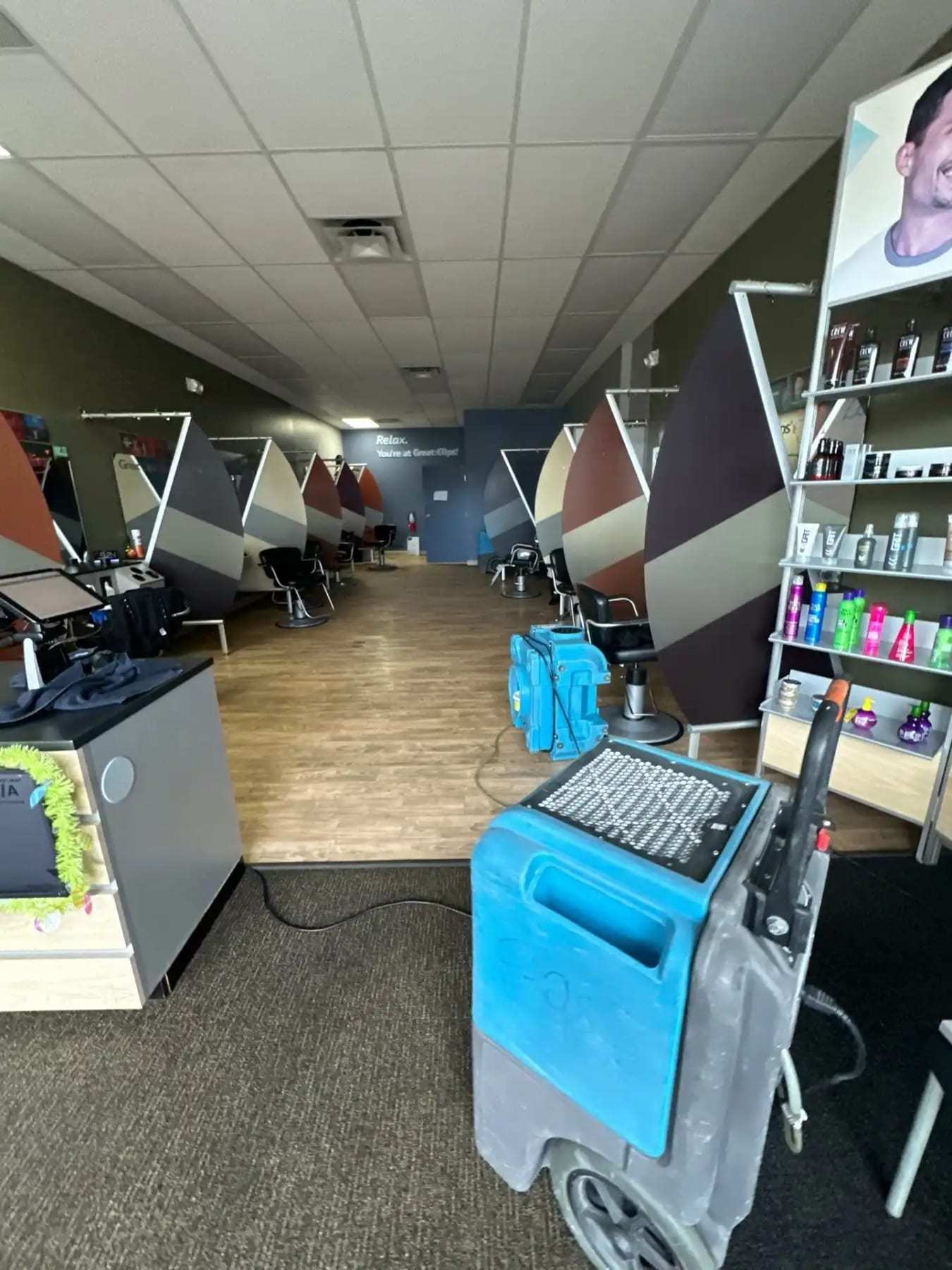 Dehumidifier running in a salon with the chairs pushed aside