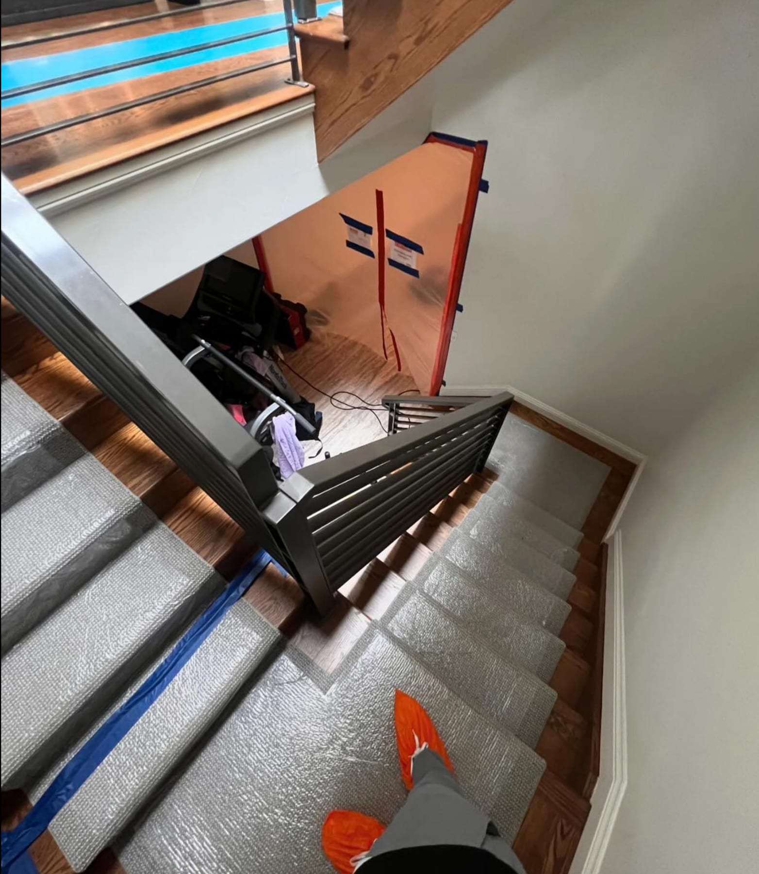 Staircase with floor protection taped over the treads