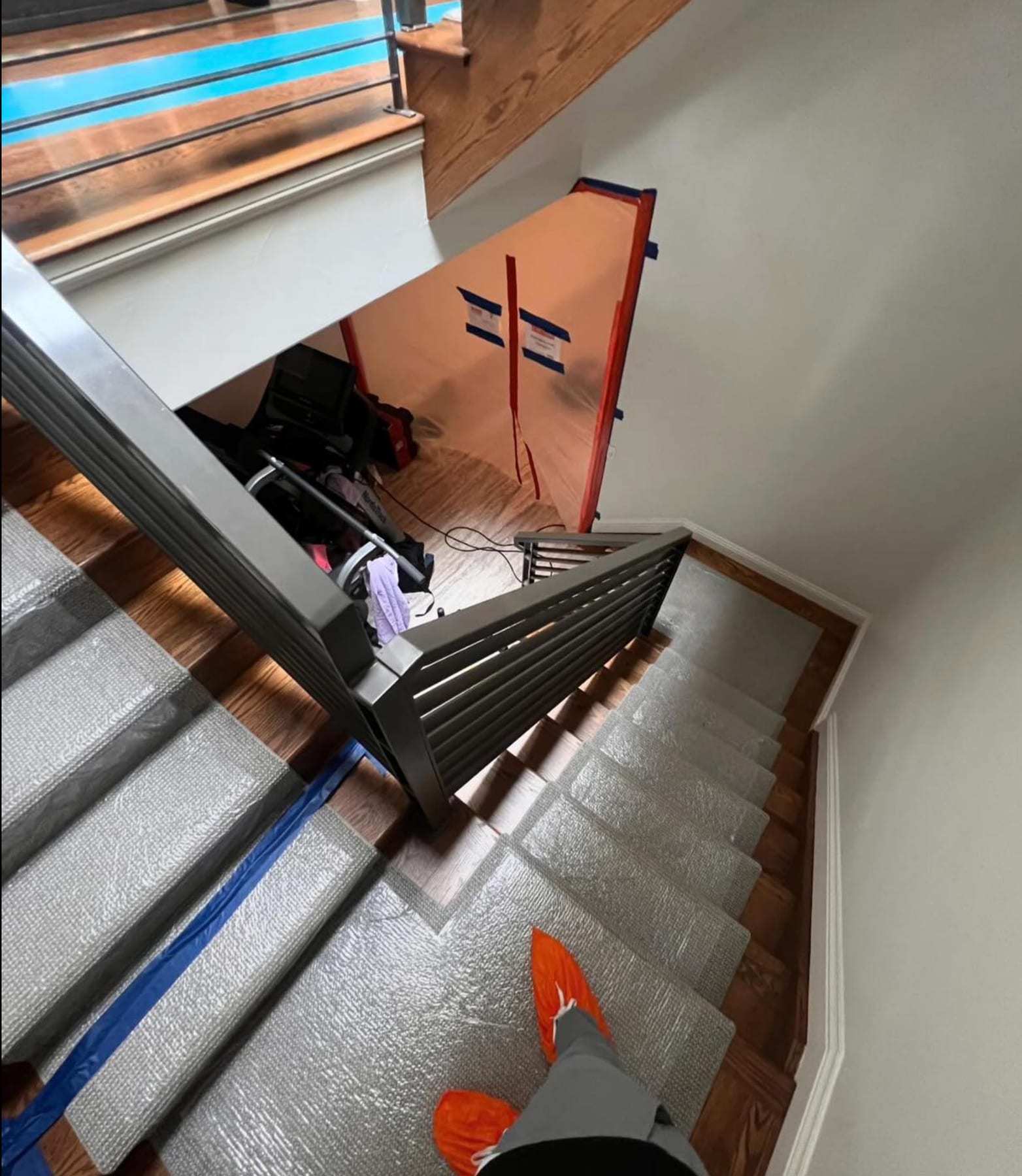Staircase with floor protection taped over the treads