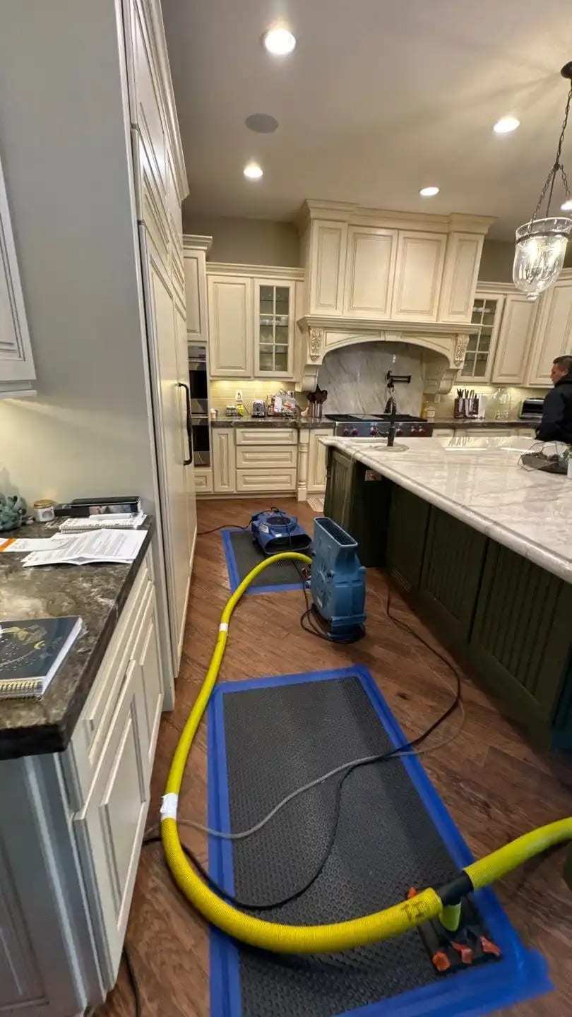 Kitchen with drying mats and hoses laid along the island