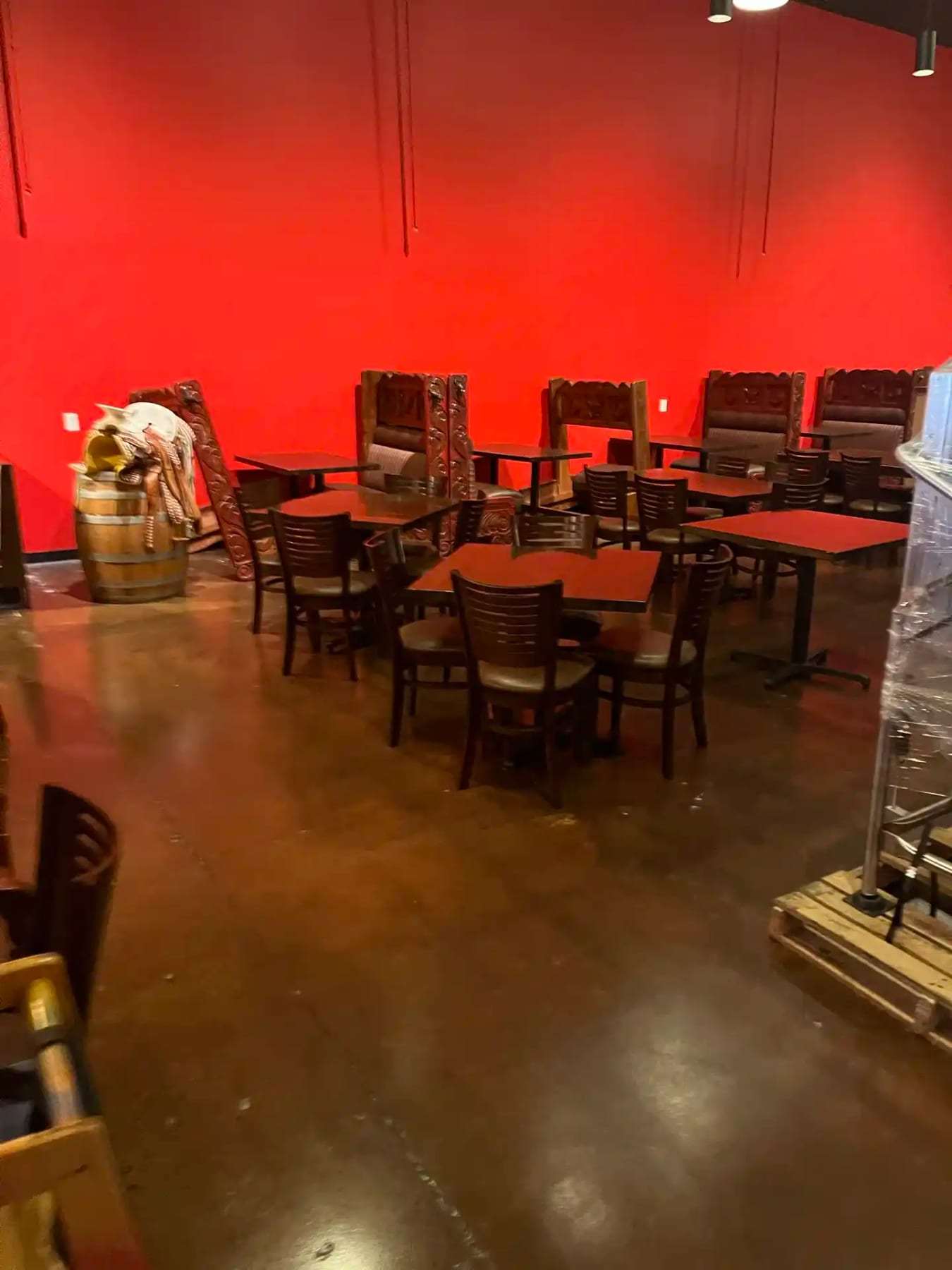 Restaurant dining room with chairs stacked on the tables